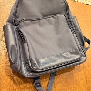 The Travel Backpack 
in navy BEIS